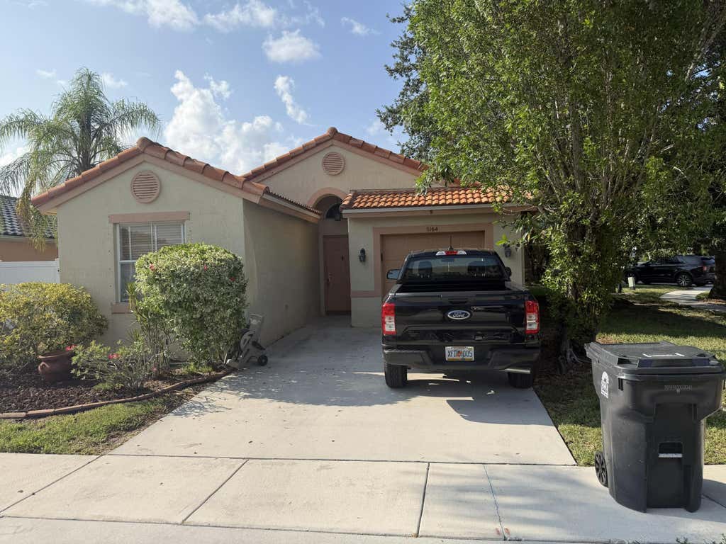 Photo of 8164 PELICAN HARBOUR Drive, Lake Worth, FL 33467 (MLS # B26058064)