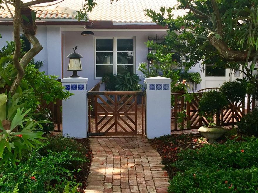 You've found your private garden oasis in this charming East Boca 3/3 located in the sought-after established neighborhood of Royal Oak Hills. From the moment you walk through the expertly designed front courtyard, lined with old chicago brick pavers and Ipe wood gate, you feel like your in wine country in Santa Barbara. No detail is spared; copper gutter, pecky cypress impact front door and soffit, and you haven't even entered the house yet!  Custom kitchen w/solid maple cabinets, solid walnut counters, Miele appliances, Kohler cast iron sink w/soapstone apron. Butler's pantry w/indoor laundry room. Weather Shield Impact windows (Aluminum exterior w/interior wood trim!) Expert carpentry throughout, framed windows, doors, built-ins. No detail was spared in this East Boca oasis! High end porcelain wood tile flooring. 2001 Roof, 2009 AC, 2018 Water Heater.  This triple split has two master suites and three full baths. Tropical paradise awaits you in the backyard, with incredible pool and multiple seating areas.  Perfect for entertaining!  Thousands of dollars of incredible landscaping.  This is a one of kind property that only comes on the market so often!  We can't wait for you to see it!