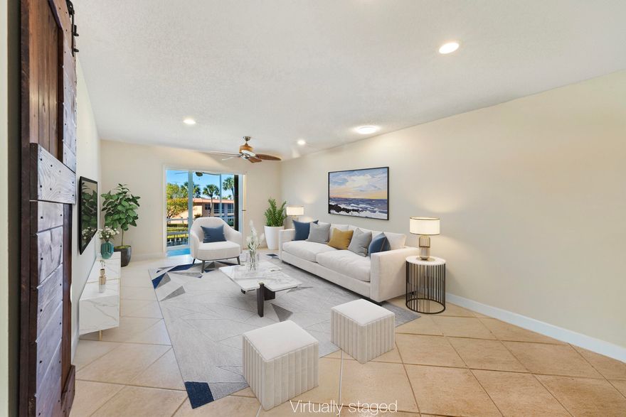 Wake up to peaceful golf and water views from this impeccably remodeled second-floor corner residence, offering a light, bright retreat ideal for relaxed seasonal or full-time living. Enjoy the confidence of predictable monthly living costs, with assessments that include unlimited golf, water, sewer, cable, internet, pickleball, tennis, pool access, and more—creating an easy, all-inclusive lifestyle that owners highly value.
Move-in ready and needing absolutely nothing, the home is completely remodeled and ready to move into and features impact windows, a newer roof, and thoughtful upgrades throughout for truly low-maintenance Florida living. 
The split floor plan offers privacy for owners and guests, perfect for hosting friends and family escaping the colder months up north. A bright sunroom offers tranquil views and fills the home with natural light from both the front and back, an inviting space for morning coffee or unwinding after a round of golf. As a corner unit, the additional windows bring even more light and openness throughout. The spacious primary suite offers a large walk-in closet and a peaceful place to recharge.

Move-in-ready home lets you arrive with just your suitcaseand enjoy the entire winter season from day one.

Located in Monterey Yacht and Country Club, a vibrant and well-maintained 55+ community, residents enjoy an active lifestyle with unlimited golf included in the monthly fee, along with pool, clubhouse, cable, water, sewer, hot water, trash removal, and building insurance.

Buy now, settle in, and trade snow boots for sunshine this winter.