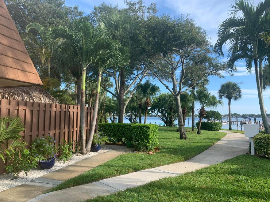 LOCATION! LOCATION! LOCATION!  Beautiful WATERFRONT townhouse located directly on the historic Loxahatchee River. PETS welcome.  Fully furnished, all utilities included plus wi/fi and cable. GREAT RIVER VIEWS from the living room and both bedrooms.   Drink your morning coffee watching boats, kayaks and paddle boarders go by or watch the full moon rise from the dock or pool.(both located on river), which are only steps away from your unit.  There is even a walk down on seawall to launch your own paddle board.  Tropical setting in this 2 bedroom, 2.5 bath WATERFRONT townhouse. Fenced private patio with your own TIKI HUT and built in grill. No smoking unit.  30 day minimum, ,monthly till middle of November.
