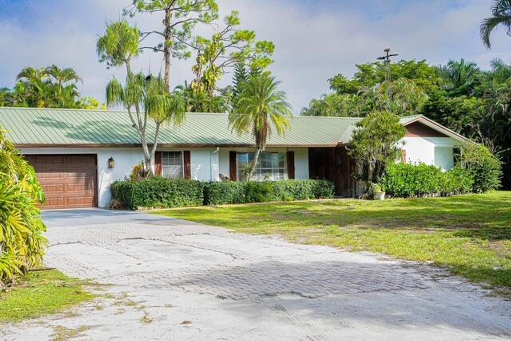 Photo of 6185 Gun Club Road, West Palm Beach, FL 33415 (MLS # R11126802)