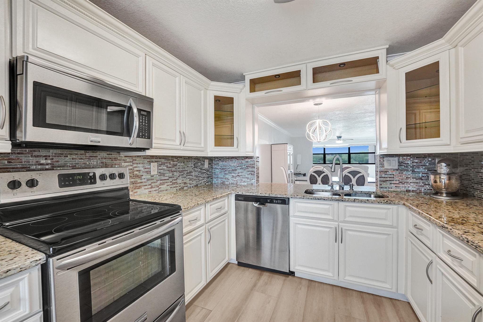 Updated & Move-In Ready in Desirable Sunrise Lakes!! This bright and stylish unit features a new A/C (2025), modern impact glass, and sleek laminate floors. The versatile layout includes a spacious primary suite, in-unit laundry, and a cozy breakfast nook with peaceful views.Enjoy the resort-style amenities of Sunrise Lakes with pools, golf, and clubhouse access all just minutes from Sawgrass Mills, shopping, and dining. A move-in ready opportunity in one of Sunrise's most sought-after communities.
