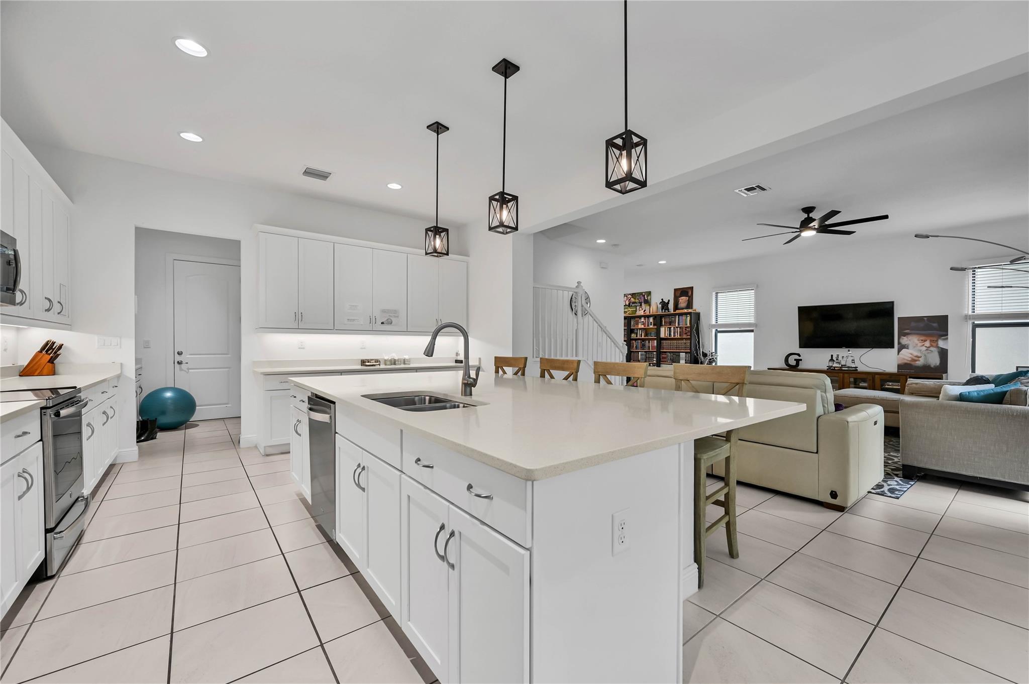 Welcome to Coral Lago in Coral Springs! This is the naturally bright 5 bedroom, 4 full bathroom newly constructed home you've been waiting for. Built in 2020, this home features over 3,000 SF under air with a large kitchen, elegant bathrooms, impact windows and is full of upgrades throughout. Backyard is fully fenced with an extended patio - make it your private oasis. Coral Lago is a gated community with clubhouse, pool, spa and a playground. Quick access to major roads, all things shopping, dining and more.