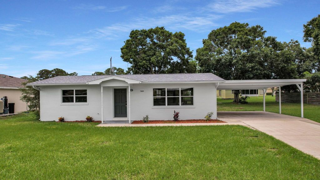 Photo of 7409 Coquina Avenue, Fort Pierce, FL 34951 (MLS # R10895405)