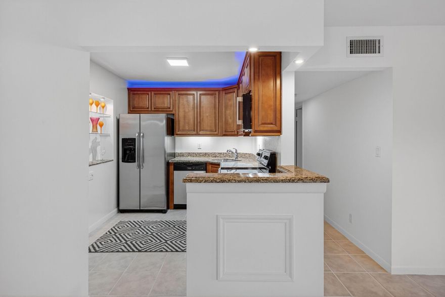 LOCATED IN A PRIME SPOT IN THE HEART OF WILTON MANORS, THIS SPACIOUS FIRST-FLOOR 2BD/2BA CORNER UNIT OFFERS 1,180 SQ. FT. OF COMFORTABLE LIVING. THE OPEN-CONCEPT KITCHEN FEATURES GRANITE COUNTERTOPS AND STAINLESS STEEL APPLIANCES. ENJOY IMPACT WINDOWS, FRESHLY PAINTED INTERIORS, TILE FLOORS, AND UPDATED BATHROOMS. JUST A SHORT WALK TO THE DRIVE, THIS HOME INCLUDES A DEDICATED PARKING SPACE CONVENIENTLY CLOSE TO THE ENTRANCE, PLUS PLENTY OF GUEST PARKING NEARBY.