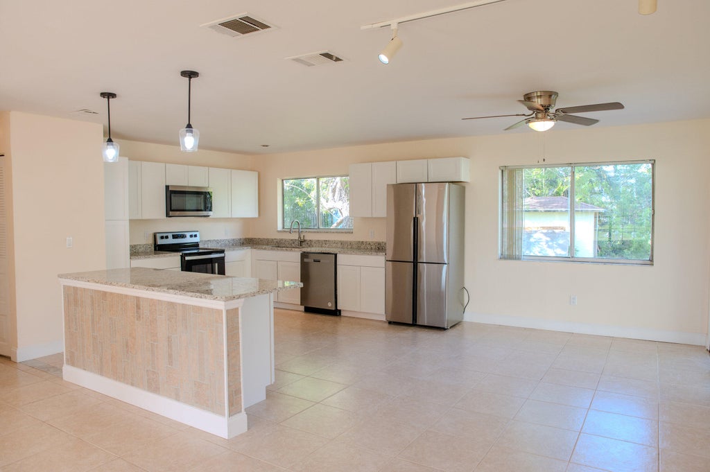Photo of 431 SE Lancaster Avenue, Port Saint Lucie, FL 34984 (MLS # R10947744)