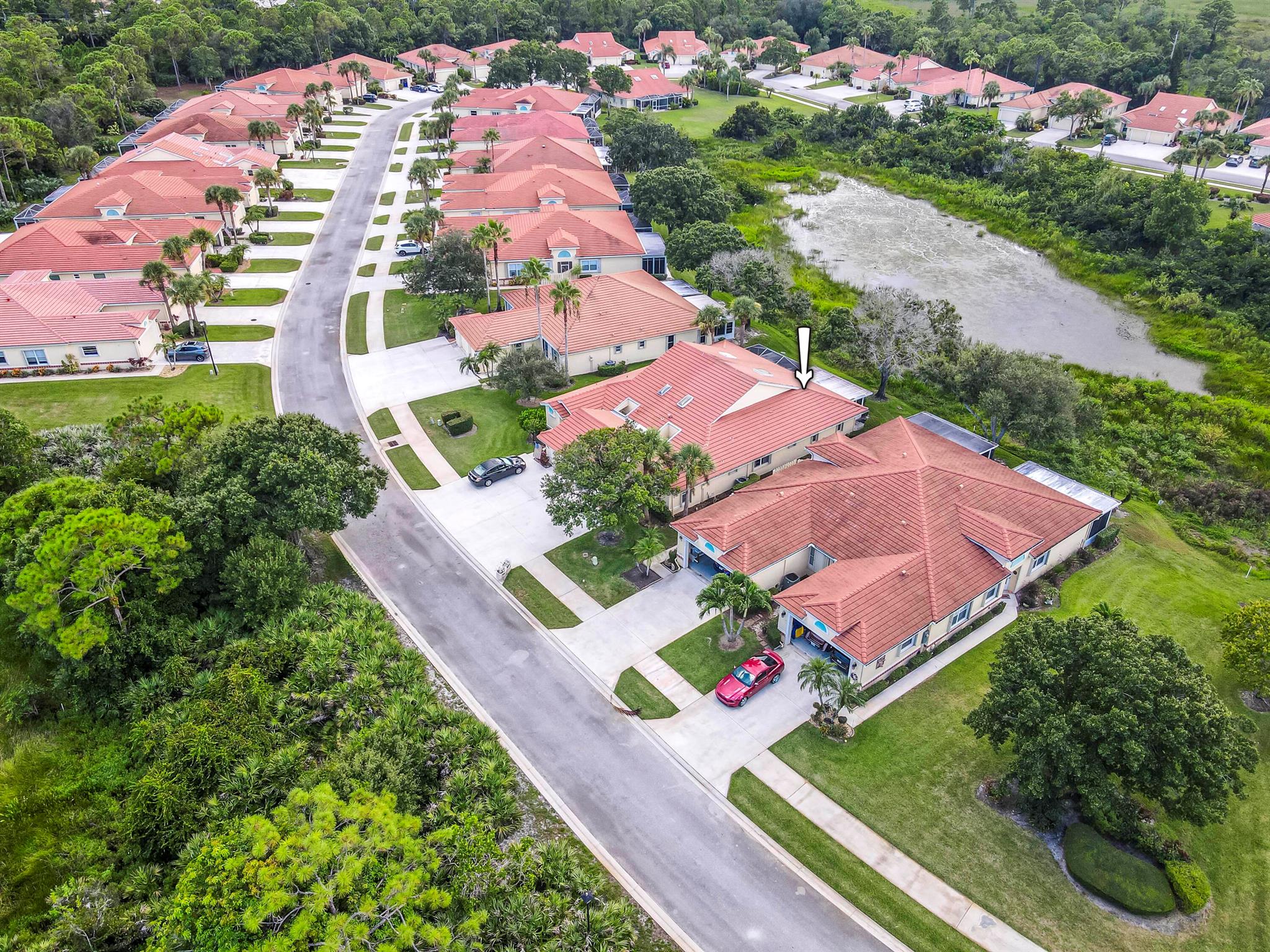 Well maintained lakefront villa in the highly sought after 55+ adult community of Whispering Sound in Palm City. This ''Chateau Green'' model is a 2/2 with 1 car garage and is one of the largest models in the community and one of the few that has a waterfront view. This home features a newer 2017 cement tile roof, newer water heater, a large screened patio overlooking the lake, accordion hurricane shutters, vaulted ceilings in living, dining, and kitchen areas, plus much more. The community offers a clubhouse, heated pool and spa, tennis, shuffleboard, and many activities. Schedule your private viewing today!