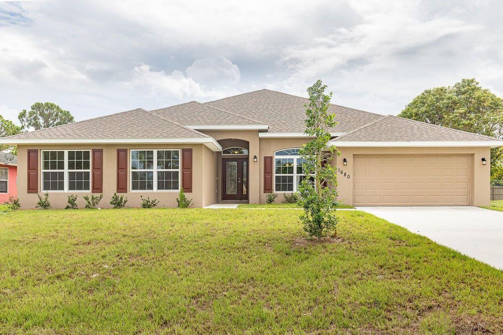 Photo of 2002 SE Parrot Street St, Port Saint Lucie, FL 34952 (MLS # R10810839)