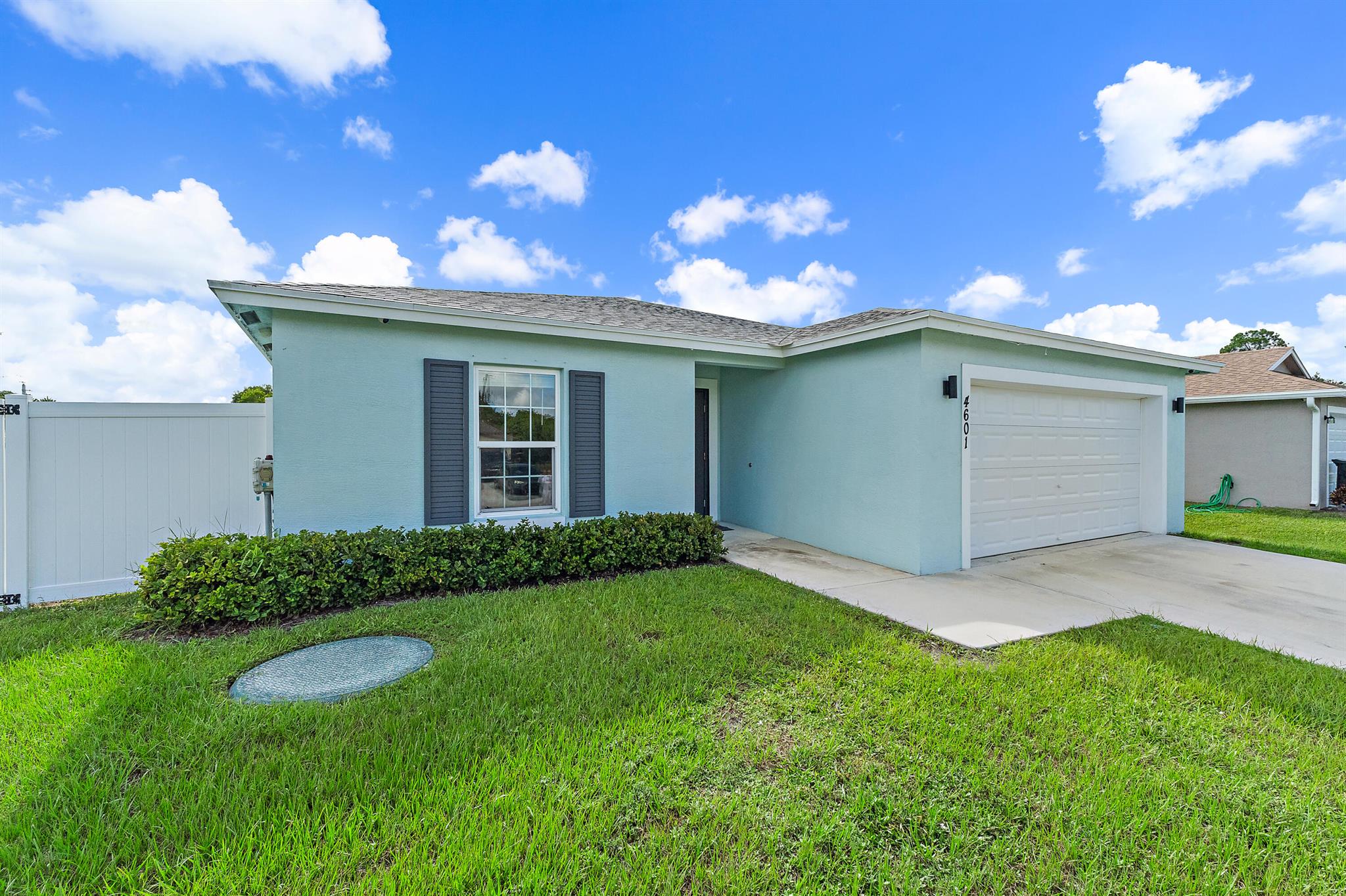 Welcome Home to this beautiful 2022 built spacious split floor plan with 4 bedrooms, 2 bathrooms, and modern finishes throughout. Step outside and be impressed by the very large, fully fenced backyard--offering endless possibilities! There's ample room to add a pool, park your RV, boat, or storage shed. Additional features include impact windows for safety and peace of mind and a 2-car garage with plenty of storage. Conveniently located in Port St. Lucie, just minutes from I-95 and the Florida Turnpike, you'll enjoy quick access to neighboring cities, shopping, dining, and all the Treasure Coast has to offer. This home is truly move-in ready and offers the perfect blend of comfort, convenience, and value all within the St. Lucie County A-rated school district.