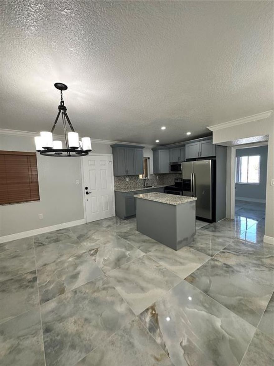 Discover the perfect blend of style and convenience in this beautifully renovated corner condo in Opa-locka. Boasting 3 spacious bedrooms and 2 modern bathrooms, this home is ideal for anyone seeking an open floor plan highlights a stunning kitchen with stainless steel appliances. Includes 2 assigned parking spaces, providing convenience and guest parking. This apartment is not just a place to live, but a statement of style and comfort. Located in a prime area of Opa-locka, close to highways and essential amenities. Don't miss the opportunity to make this your new home!