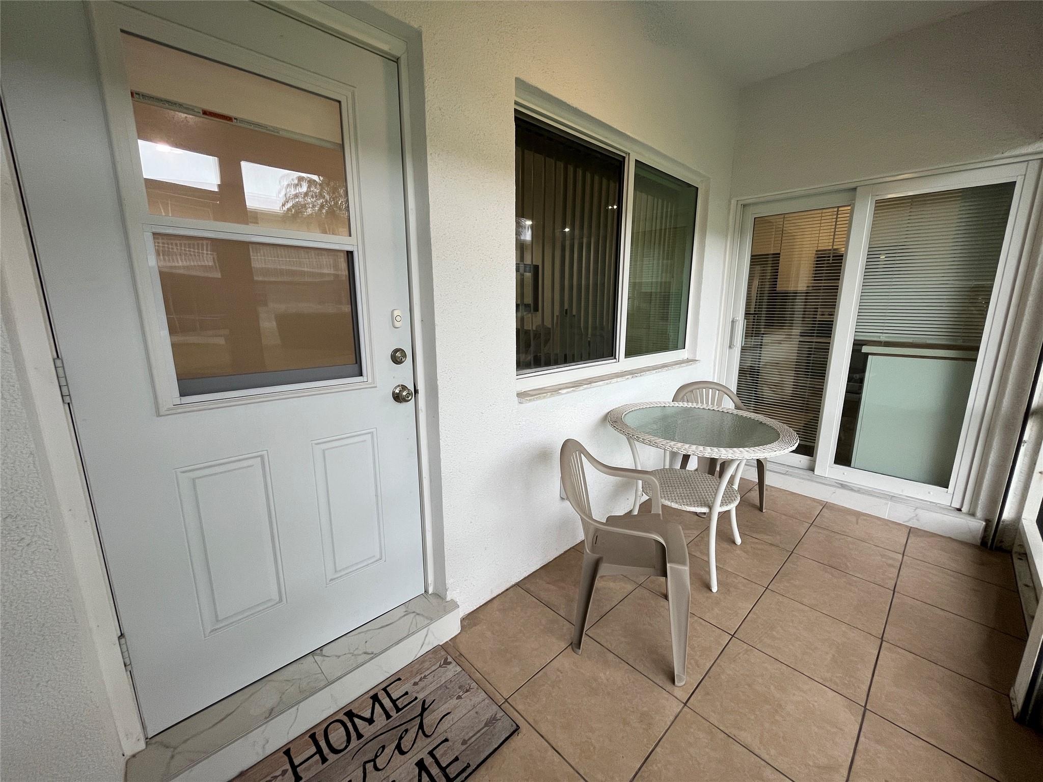 Beautiful and immaculate, turn-key, furnished, first floor, 2 bedroom, 2 bathroom, in the peaceful 55+ community of Tarleton Manor. This unit has its own newer washer/dryer and is completely remodeled featuring an updated kitchen with granite countertops, and stainless steel appliances, two updated bathrooms with frameless shower doors, impact windows and impact slider to the covered private screened patio. Both bedrooms have closet built-ins. The unit has tile throughout. A/C 2020 and HWH 2022. There is one assigned parking spot right outside your back door and you are walkable to Publix, the library, and more. Step outside your apartment and enjoy the private courtyard and amenities offered: pool, shuffleboard, BBQ area, clubhouse. A private locker for extra storage is also included.