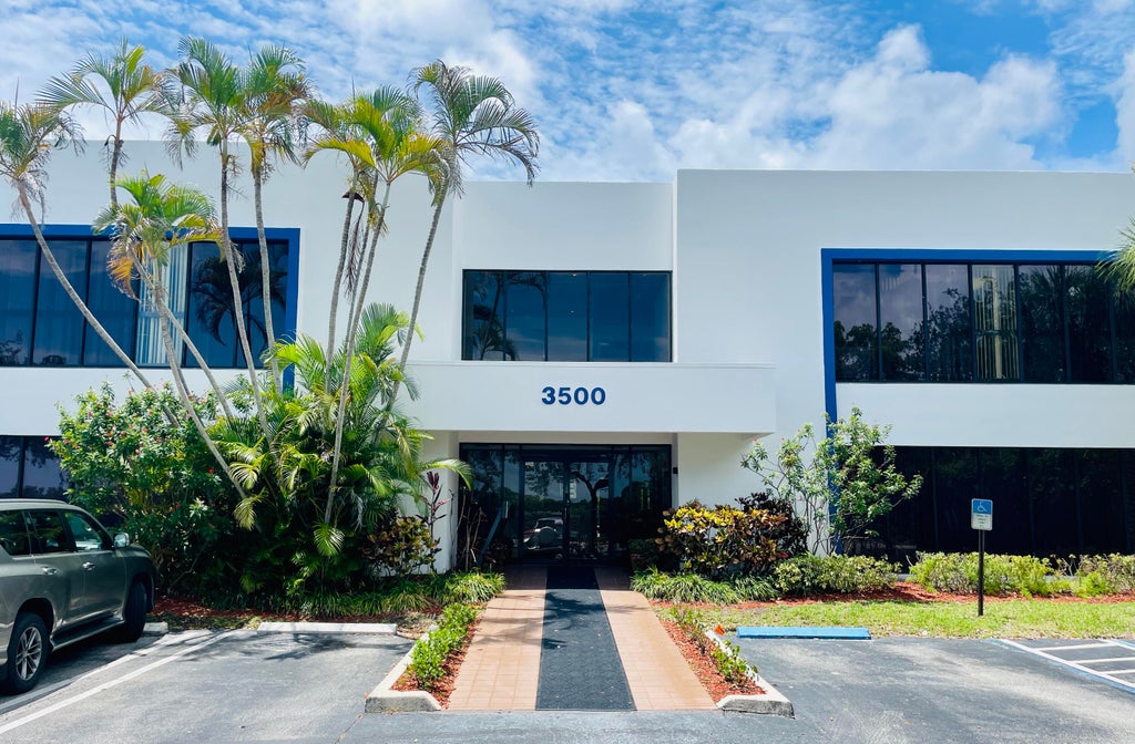 Photo of 3500 GATEWAY Drive #104, Pompano Beach, FL 33069 (MLS # B26080231)