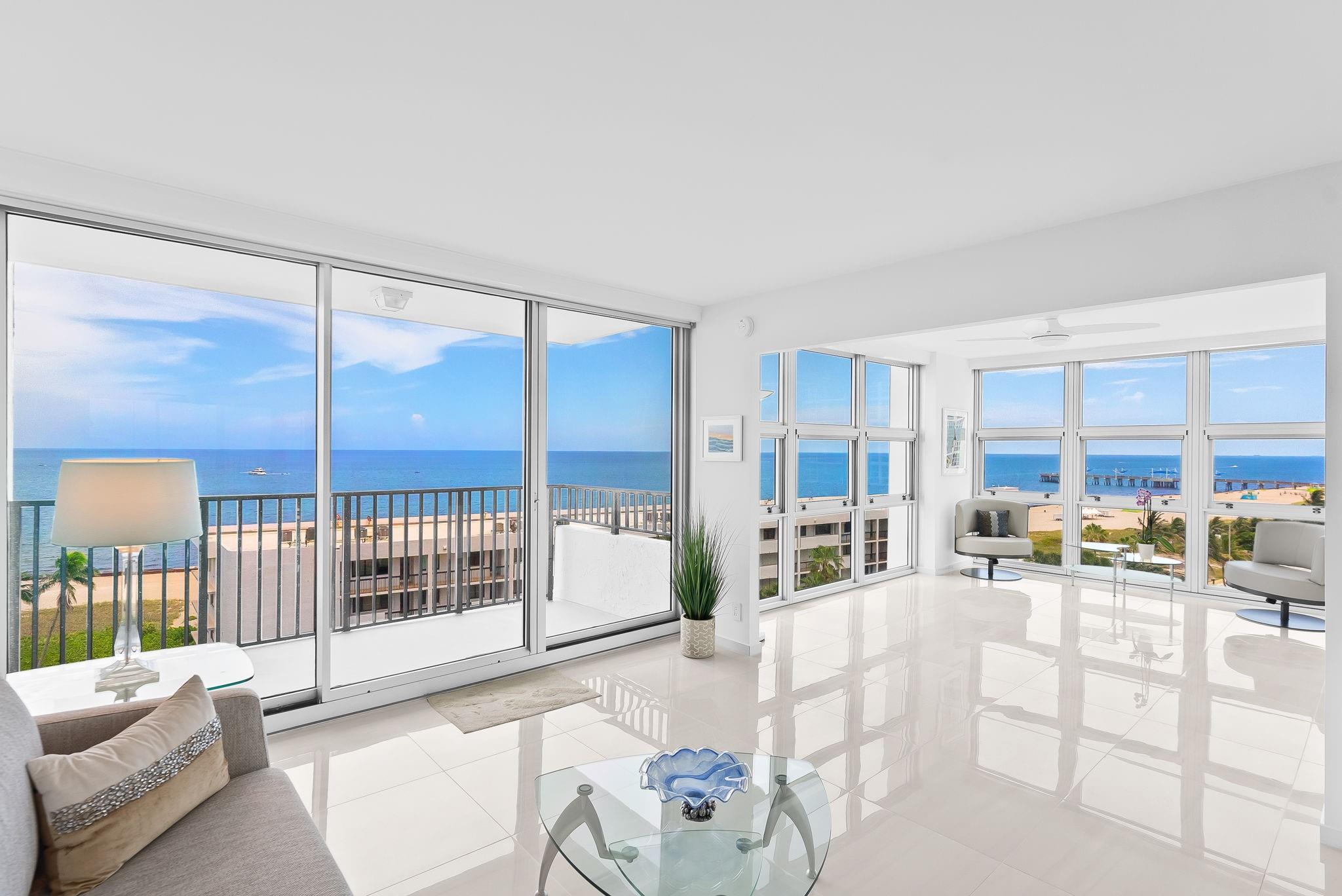 DIRECT OCEAN, panoramic views dress this spacious condo to make you feel as though you're walking on air. The space is filled w/ views of the Atlantic Ocean everywhere you look. Impeccably maintained w/ gorgeous, white tile floors + STUNNING all white kitchen. View the ocean while you cook w/ your top of the line appliances. Your views reach the beachfront restaurants + brand new pier, as well as the private beach entrance. Walk in closets in both bedrooms + 2 full bathrooms. Both have beautiful white and blue wall coverings that accent the fresh feel of this condo. Windows are hurricane impact with special film to increase protection. Lots of storage. Electric, solar shades throughout. Amenities include tennis/pickleball court, 2 pools, sunset kitchens, fitness center + 24/7 security.