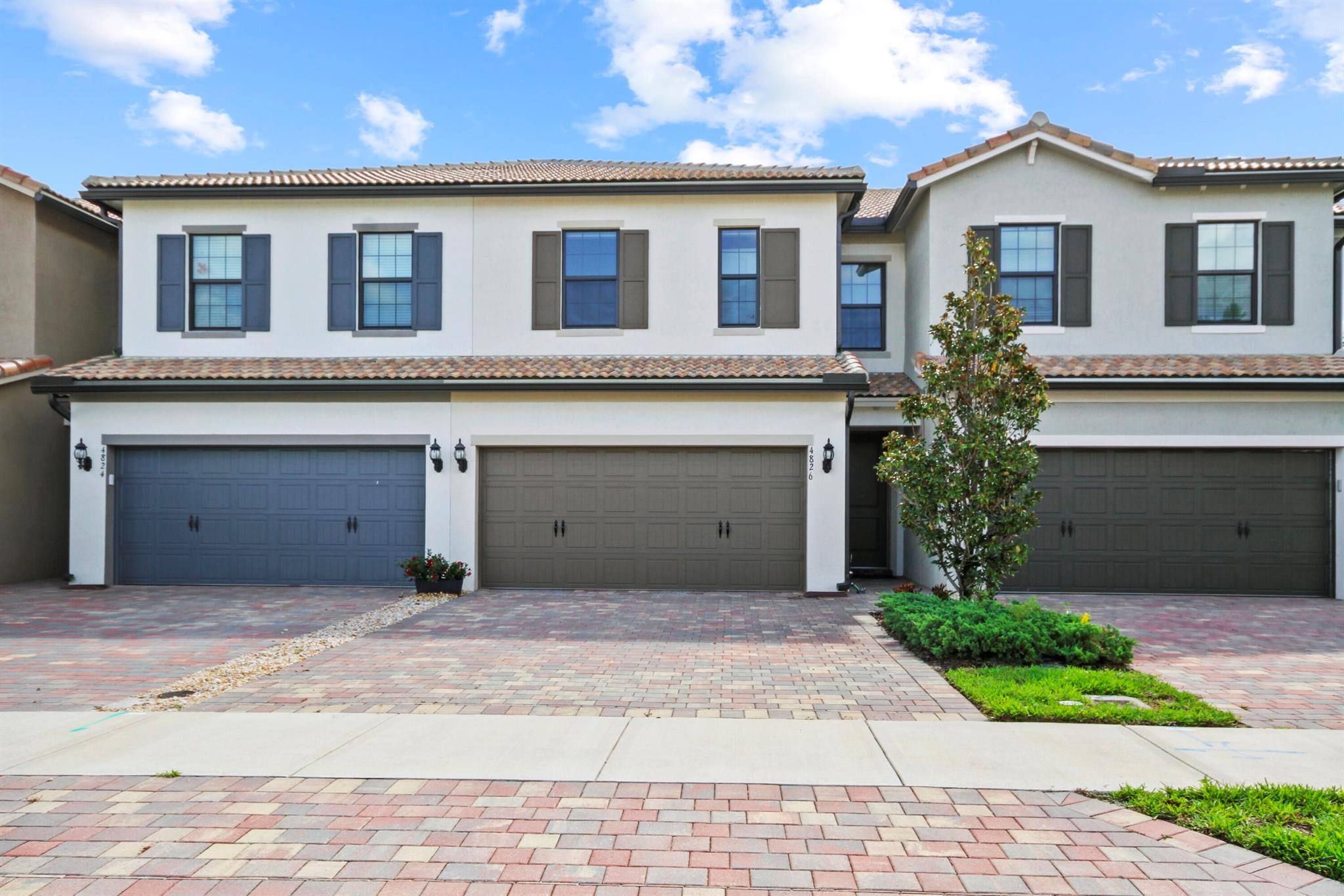 Built in 2023, this spotless townhome with no carpet, and impact windows will not disappoint. With a big open floor plan & a beautiful serene view of the lake, this home features classic quartz countertops, eye catching backsplash, and new stainless steel appliances. There is a lot of storage space and a half bath for convenience. The huge primary bedroom and large full bathrrom is located upstairs with lots of privacy and breath taking views; featuring 2 walkin closets, a spacious bathroom with quartz and dual sinks. There are two other bedrooms and a large bathroom located on the second floor with an addtional linen closet. The washer and dryer are located on the second floor for convience Close to A Rated Schools, the Turnpike and the Wellington Mall, & 8 miles to prestine beaches