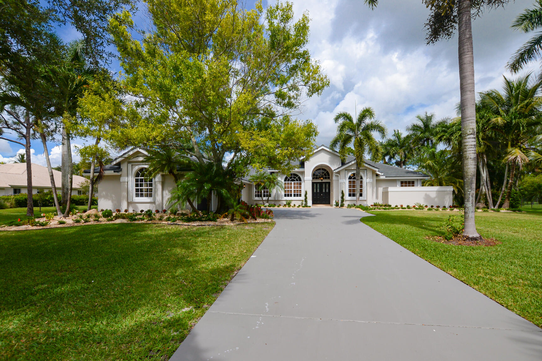 A magnificently remodeled, beautifully appointed, private estate with pool located on a 1.15-ACRE lot boasting panoramic water and golf views. Everything has been done for you. With oversized porcelain flooring in the main living spaces, and bedrooms, the open floor plan pairs beautifully with the newly redone kitchen including appliances soft close cabinets, and stunning granite. Luxury abounds in this home with 5 bedrooms (the fifth bedroom lends itself as an office or den), and 4 bathrooms redone with travertine, new vanities and a soaker tub in the master, Feel like you live on your own private oasis and simply move right into this ultra-luxurious contemporary, yet comfortable home, situated on a picturesque lot. LUXURY AND PRIVACY AT IT'S BEST.