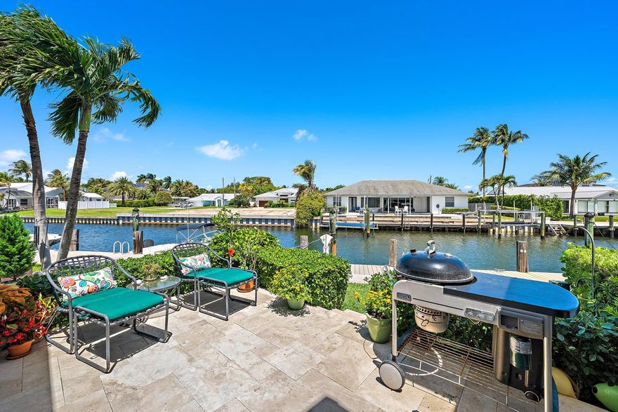 A 25-foot freshwater boat slip in private resident only marina sets the tone for this exceptional 3-bedroom, 3-bath waterfront townhome in the exclusive gated waterfront community of Mariners Cove.  Bright, airy interiors feature impact glass, designer details, wood/porcelain tile floors,  refinished bathrooms, and a custom kitchen. Outdoor living shines with a screen enclosed patio and open deck overlooking tranquil water views.  Designed for the boating lifestyle, enjoy a resort style clubhouse pool, fitness center, direct Intracoastal access, no fixed bridges, and easy ocean access—all just minutes from pristine beaches, the Juno Beach Pier, boutique shopping, fine & casual dining, and Palm Beach International Airport. A must see!