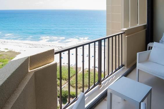 Welcome to Paradise SINGER ISLAND! RENOVATED & FURNISHED unit, 15th floor, Phoenix Twr B. Spectacular NE & NW views of both the Atlantic Ocean & Intracoastal. Gorgeous sunsets! 2 bdrms and 2 full baths. Owner has spared no expense! No popcorn ceilings, Marble floors throughout, remodeled kitchen with counter and counter, stainless steel app., 2 full bathrooms all redone. Walk in closets. Hurricane impact doors, windows. Washer/dryer on floor. Gated access, pickleball, pool, tennis, gym, shuffleboard, BBQ, etc. Covered parking space and storage bin. Ready to move in or rent 4 times/yr immediately. Direct beach access with umbrellas and chairs. Priced to sell! Don't miss this opportunity to own a piece of paradise at a great price!FULLY FURNISHED, SOME ARTWORK AND PERSONAL ITEMS EXCLUDED TBD
