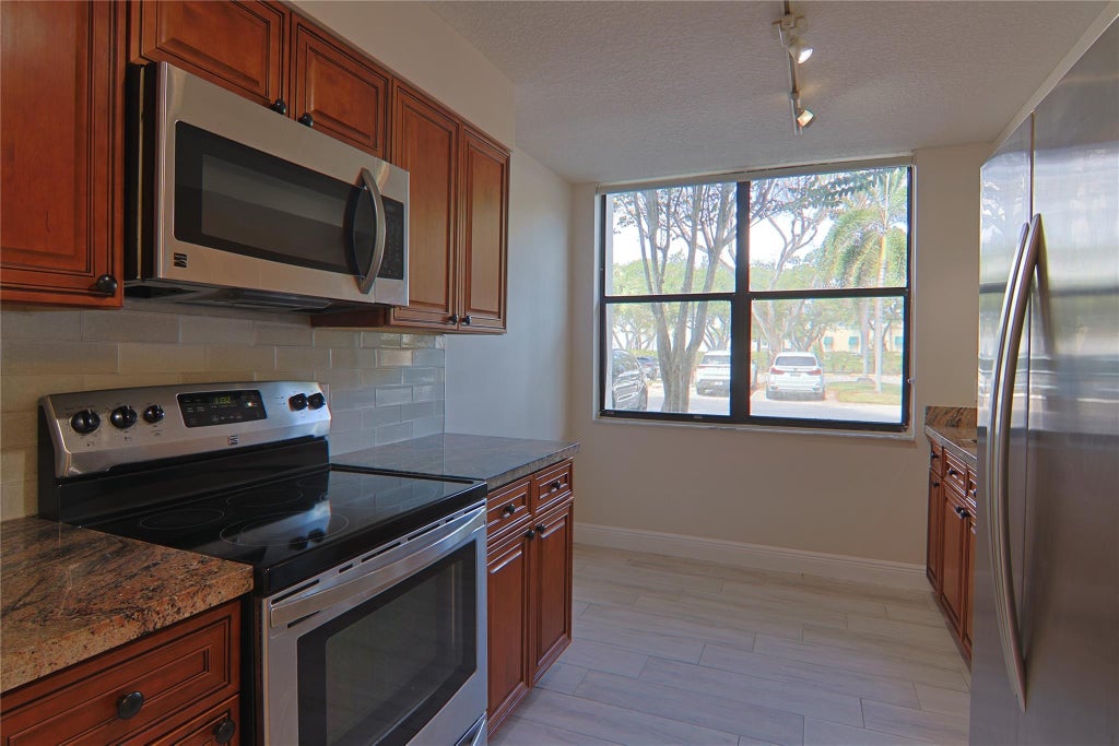Photo of 2025 Lavers Circle #D101, Delray Beach, FL 33444 (MLS # F10456652)
