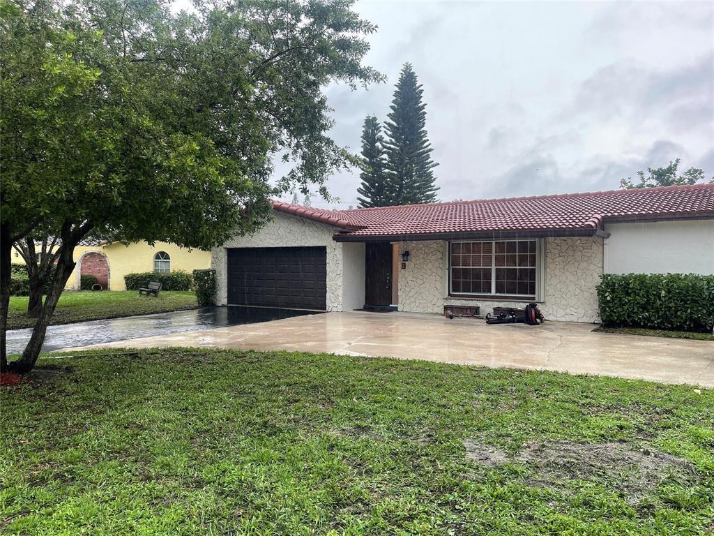 Beautiful Updated ranch style home with 4 bedrooms and 2 bathrooms plus a 2 car garage that includes a big circular driveway for ample parking for a family of drivers. Located in beautiful Coral Springs. Lots of room to enjoy. Big fenced in back yard to entertain and/or room to run for your pet. Near by city parks. Plenty of nearby stores and restaurants. Good schools. Short distance to the Sawgrass Express Way. Freshly painted inside and professionally cleaned ready to be tenant occupied immediately. Credit and back ground required through Rentspree. Credit and back ground check. $50.00 fee.