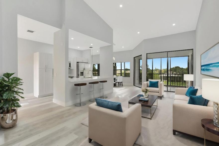 This luxury unit in Platina provides the best in resort-style living. HOA fees cover AT&T fiber optic high-speed internet, pest control, lawn care, roof maintenance, building exterior maintenance, and all water. This beautiful 3-bedroom, 2-bathroom home with a 1-car garage offers over 1,724 square feet of living space. Completely renovated, it features vaulted ceilings, a split open floor plan, and an updated eat-in kitchen with Quartz countertops, custom cabinets, and brand-new stainless-steel appliances. The master bathroom boasts triple LED mirrors, a grand custom double shower, dual sinks, built-in makeup counter, and luxury porcelain flooring. The home also includes ample storage space, a private driveway, and a canal-front patio accessible directly from the master bedroom. Suitable for all ages, it is ideally located near major highways, local shops, and entertainment venues. The impressive 20,000 square foot clubhouse features a café serving breakfast and lunch with take-out options, card rooms, and a fitness center with a solarium overlooking the pool. Enjoy the satellite pools, a large main pool with a spacious sundeck, and courts for tennis, handball, and pickleball. There's even an art room with a kiln. The community offers a variety of activities including shows, bingo, and numerous clubs, ensuring you'll always have something to do. With 24-hour guard-gated security, the community provides convenient access to I-95 and the Florida Turnpike, as well as nearby shopping and dining options.