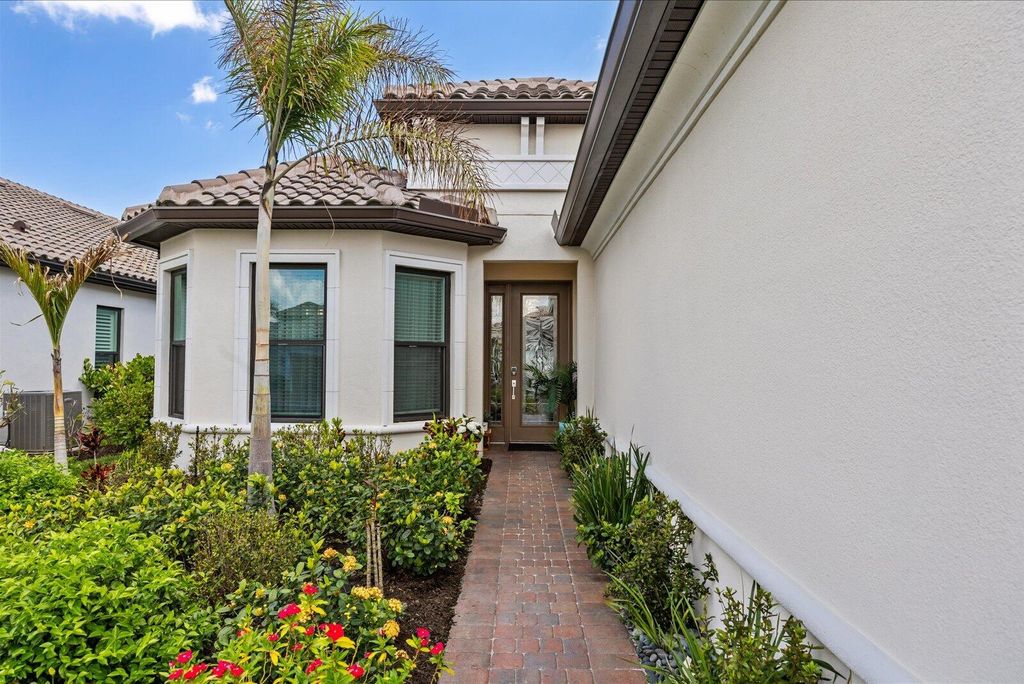 Photo of 9959 SW Cloister Drive, Port Saint Lucie, FL 34987 (MLS # B26009339)