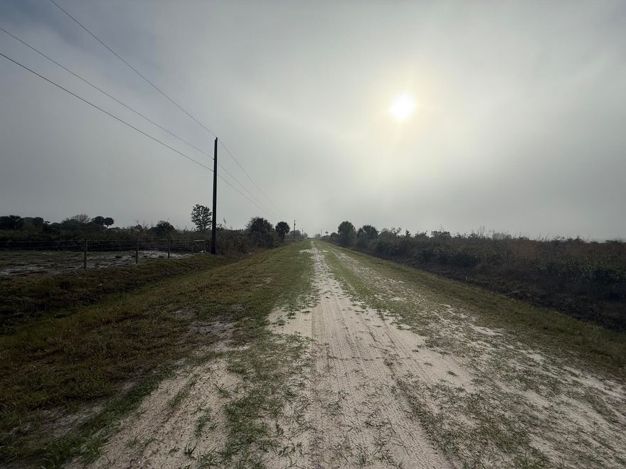 Rare opportunity in Okeechobee! Two adjoining parcels being sold together as one expansive 2.5-acre homesite. Conveniently located just off Peavine Trail, a main paved road, this property offers easy access while maintaining a peaceful, rural setting. Approximately 1.50 acres have already been cleared, saving you time and money. Property features an installed culvert and fenced frontage for added convenience and access. Electricity is available at the street, making it easier to plan your future build or investment. Plenty of room for your custom home, workshop, or recreational use. Don't miss this versatile land opportunity in a growing area!