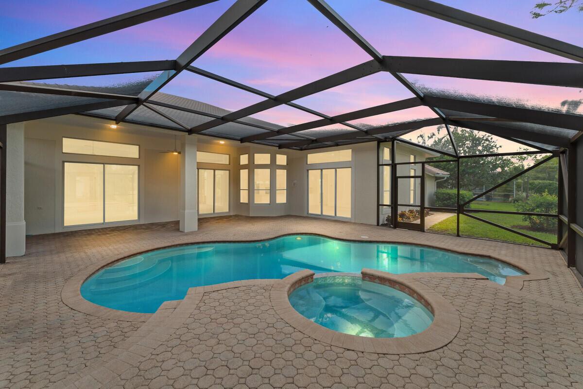 Everything is NEW NEW NEW. Gorgeous, fully renovated home in the highly sought-after Hammock Creek Sanctuary! This beautiful residence features an open floor plan with a split-bedroom layout, ideal for privacy and entertaining. The open kitchen dazzles with a large island, all-new stainless steel appliances, custom cabinetry, and Taj Mahal quartz countertops. Completely remodeled bathrooms boast modern vanities, elegant tilework, and luxurious fixtures. All-new flooring, paint, washer/dryer, and fixtures throughout elevate this move-in-ready masterpiece. Refreshed landscaping and $15,000 in pool repairs and NEW equipment. This house is move in ready - make it your home today. Experience style and comfort in a prestigious community. Don't miss out!