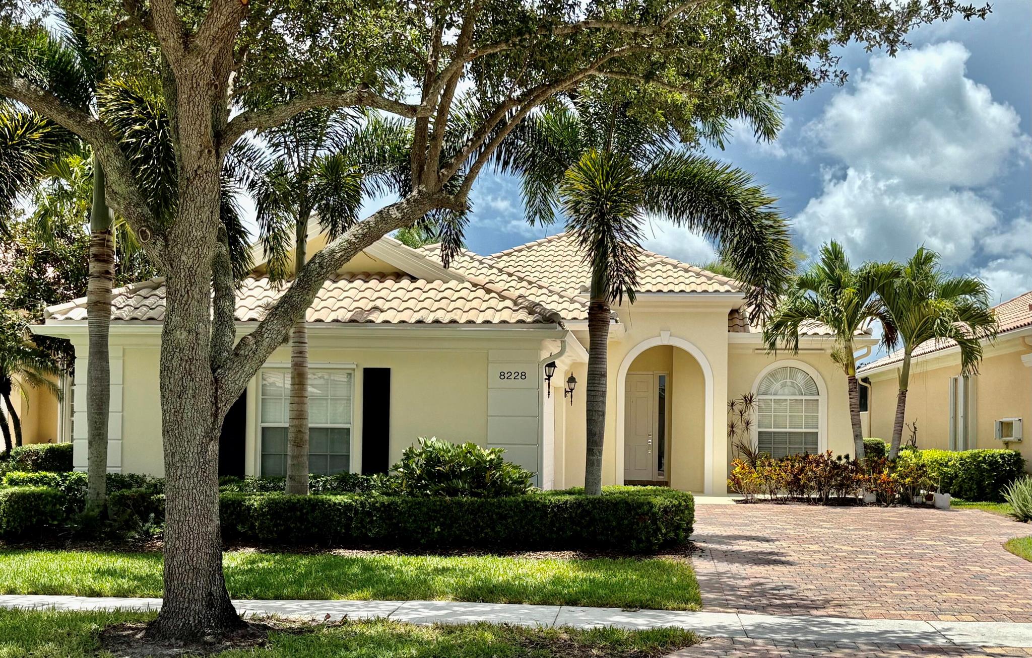 Welcome to 8228 Xanthus Lane located in the beautiful gated resort style community of VillageWalk. This 3 bedroom 3 bath home with a den has been completely renovated from top to bottom. Built by DiVosta with solid poured concrete construction, this home offers exceptional quality style and functionality. Step inside to a spacious open concept layout that seamlessly blends the living dining and kitchen areas, perfect for everyday living and entertaining. As you enter the home, you are immediately drawn to the expansive lake views. Neutral wood look luxury PVC floors run throughout the entire home. The back of the home faces south, offering abundant natural light year round.The kitchen has been fully redesigned with custom cabinetry, large drawers for ease of use, extra storage