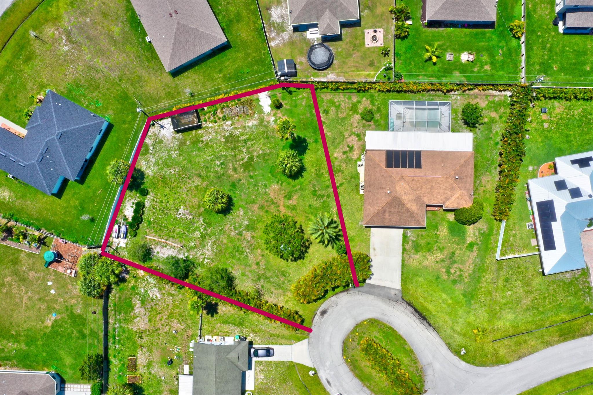 Beautiful vacant lot on a cul-de-sac, cleared and high ground with some Areca palm trees  for privacy. 5 survey pins in the back an 2 on front of lot. Avaialble underground city water and sewer. All assessments are paid in full. Lot is .33 acres, Great opportunity to own.