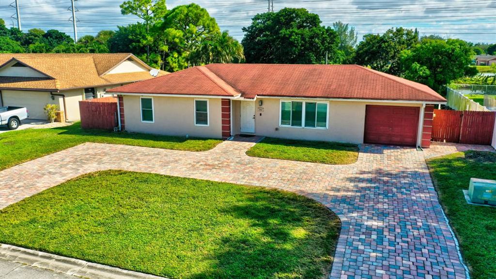 Photo of 252 Sandpiper Avenue, Royal Palm Beach, FL 33411 (MLS # R10761409)