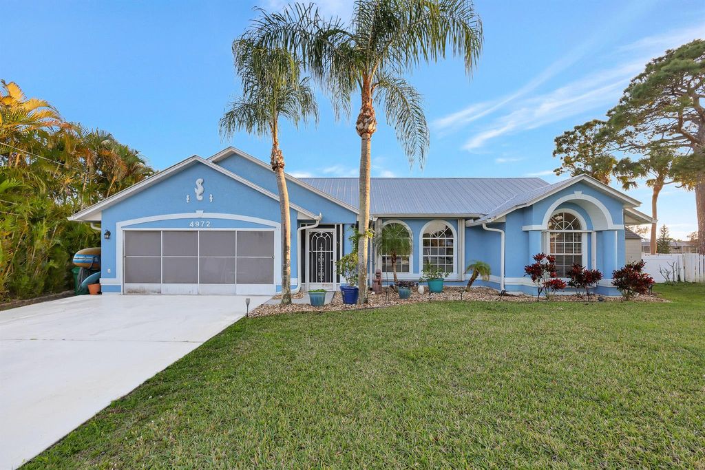 Photo of 4972 NW Foxworth Avenue, Port Saint Lucie, FL 34983 (MLS # R10963541)