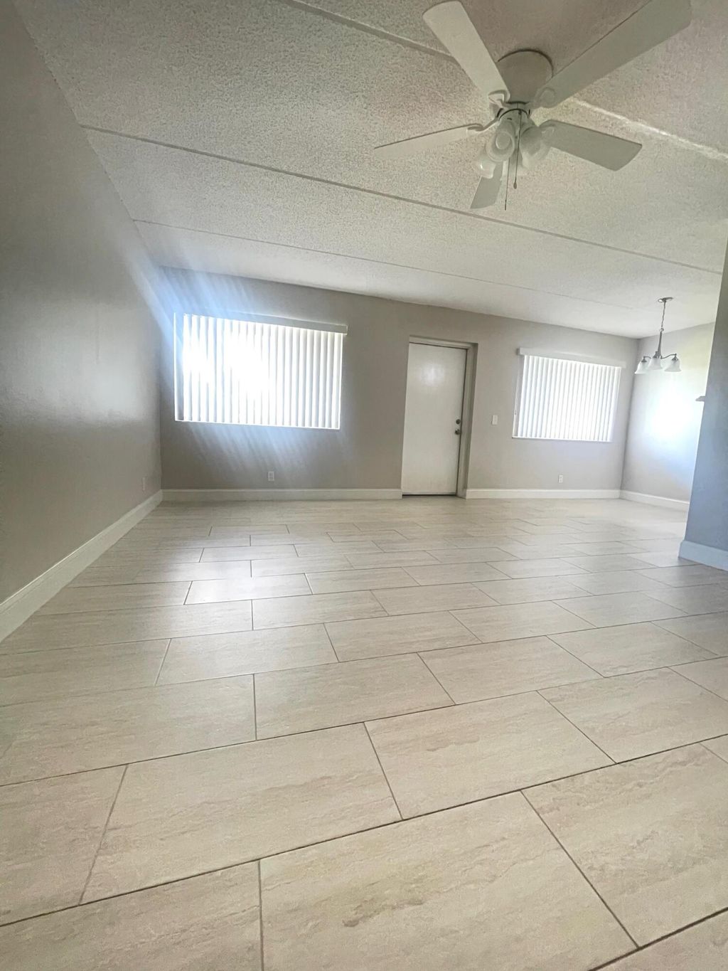 Photo of 100 Village Green Circle E #112, Palm Springs, FL 33461 (MLS # B26011219)