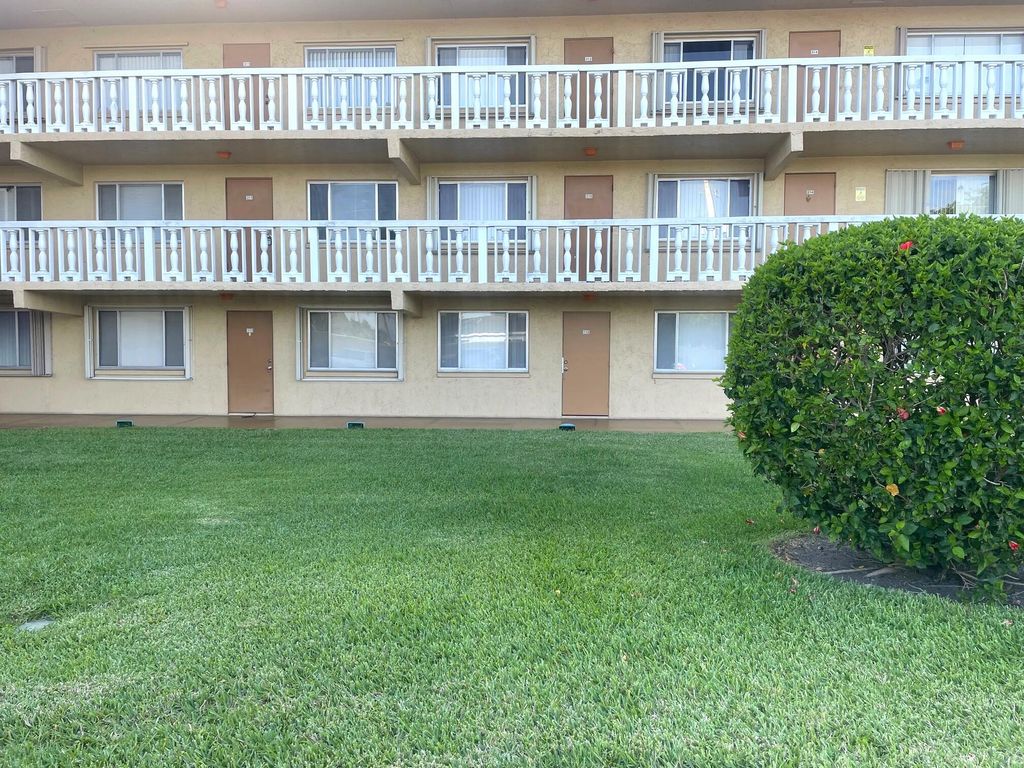Photo of 100 Village Green Circle E #112, Palm Springs, FL 33461 (MLS # B26011219)
