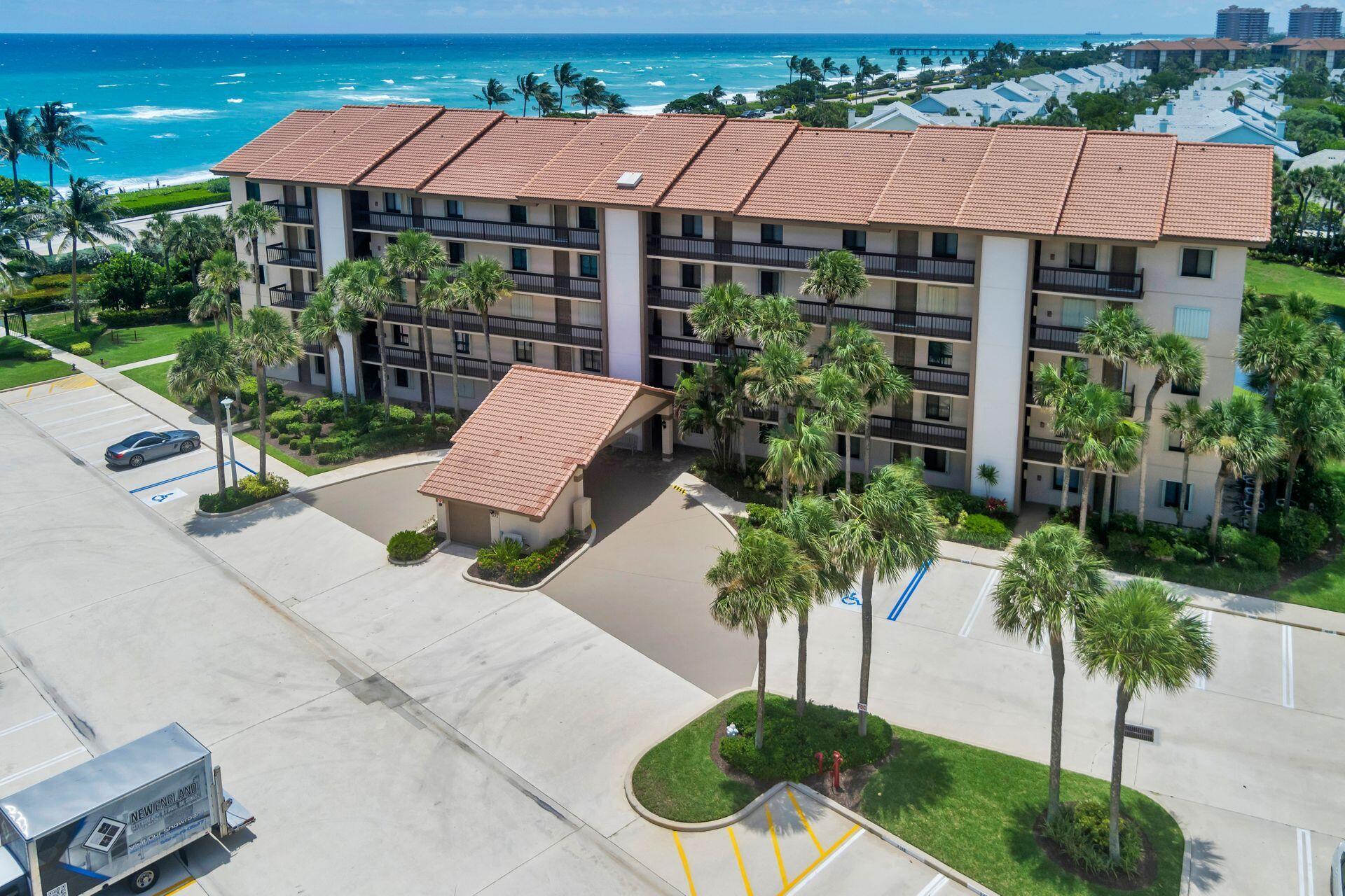 Top Floor...Ocean Views...Steps to the Beach! This annual rental, located in a gated community, has incredible ocean views, being situated in the building closest to the beach. It features vaulted ceilings & has been updated & tastefully furnished, making it a truly turnkey option ready for immediate move-in. The open balcony is an ideal spot, perfect for enjoying morning coffee as the day begins or unwinding with evening drinks. It offers a wonderful setting to relax & take in the surroundings. The community provides fantastic amenities, including a gated walkway directly to the beach, a beautiful pool just steps away from the condo as well as tennis/pickleball courts. Its prime location also means you'll be close to dining, shopping, golf, restaurants & a short 30 minute drive to PBI.