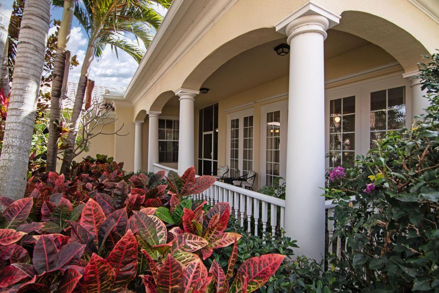 A MUST See Carlyle on CUL-DE-SAC with Extra LARGE PROPERTY on the charming street of FUTANA WAY.  OWNERS pampered this home with LOVE!! Freshly Painted Neutral Beige throughout,  Beautiful Tiled Key West Style Front Porch, Stainless Steel Newer Appliances, Built in Wall Unit, NEWER AC & Hot Water Heater. Wide Water view from Screened in Tiled Patio with additional outside open patio area.