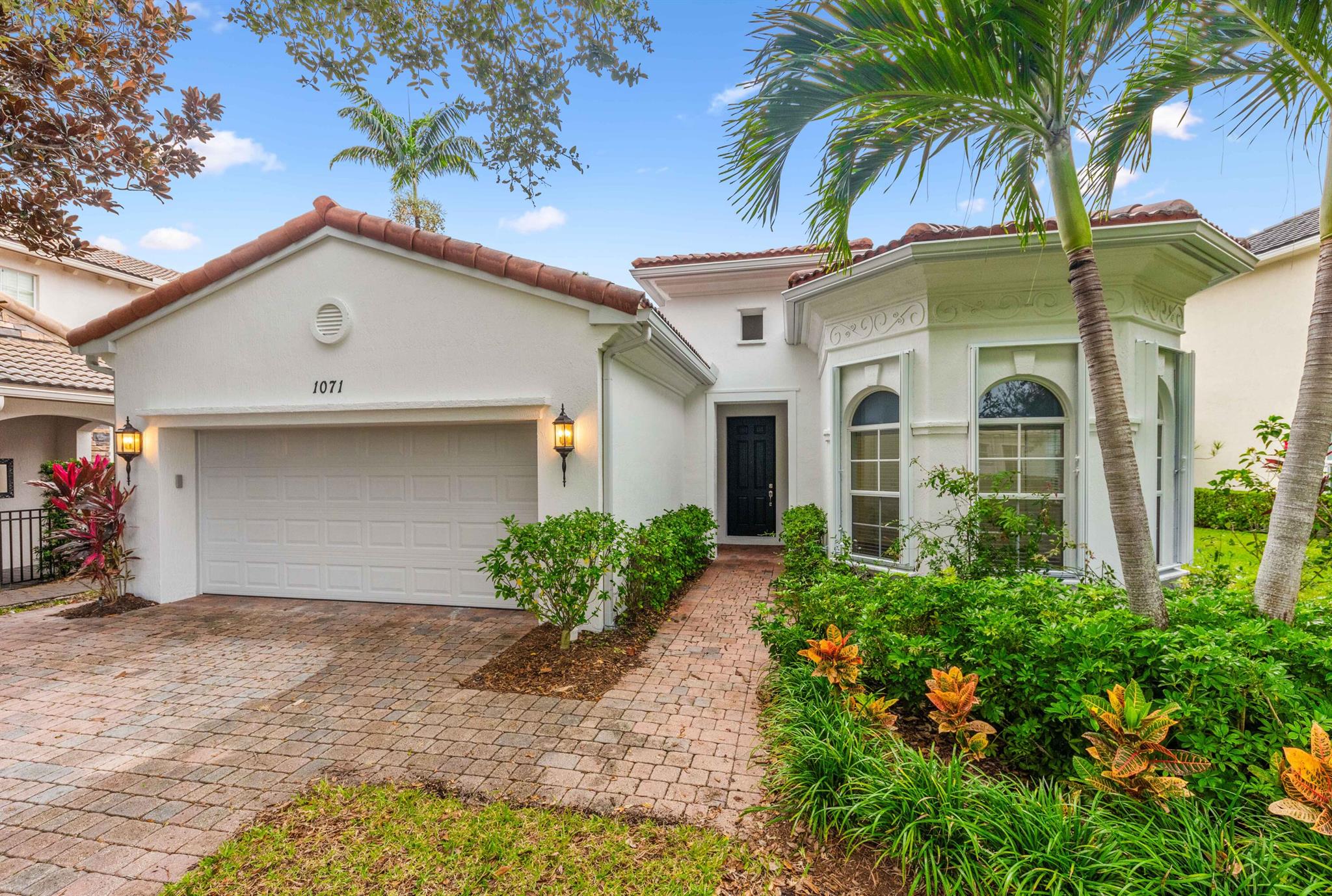 This renovated single-story home in Evergrene, Palm Beach Gardens offers comfortable living with its spacious layout. It features 2 bedrooms, 1 den that could be converted to another bedroom and 2 bathrooms, providing ample space for your needs. The home boasts a large private backyard with a lush landscape setting and a covered lanai, perfect for enjoying the outdoors. Don't miss the opportunity to make this your dream home in a desirable location. The open floor plan with volume ceilings creates a great sense of space. The kitchen has been beautifully transformed with newer stainless steel double oven, warming oven, and gas cooktop. The addition of beautiful new quartz countertops, a designer backsplash, and a new sink and faucet adds a touch of elegance to the space.