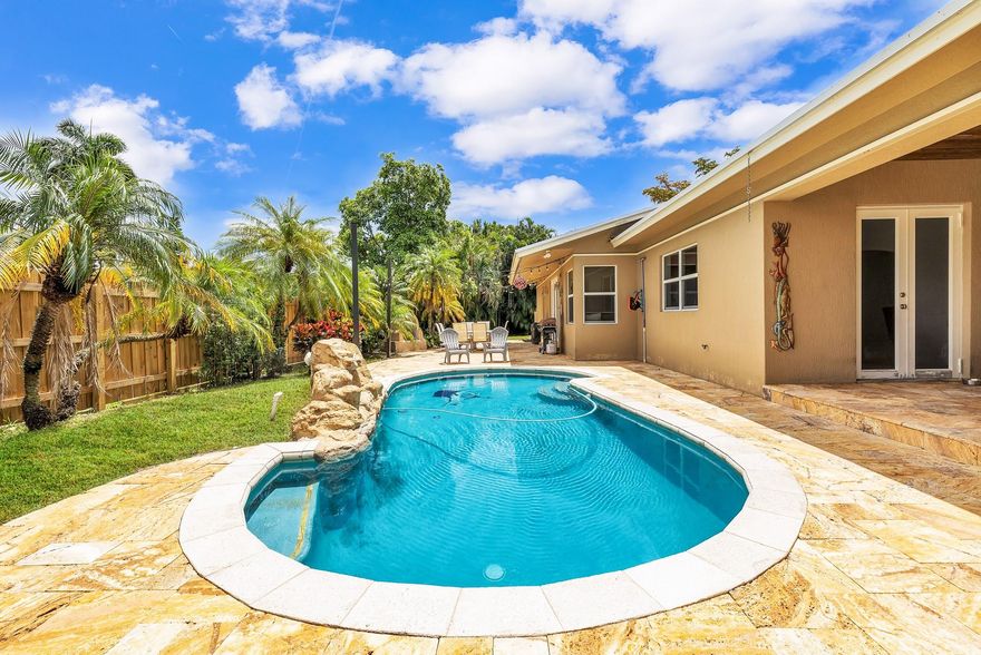 Come live in this Davie Estate Home that features a brand new roof, impact windows & doors, oversized pool, 9/10ths of an acre lot that has 4 bedrooms & 3.5 bathrooms. Zoned agricultural, No HOA, bring your boat, RV, animals & favorite toys. A 3 way split floor plan in an open concept home. Master bedroom has a walk-in closet plus an additional sitting room that is great for an office space, workout area or nursery. Enjoy a large playroom area/office/den that has a two-sided fireplace that leads you to 2 bedrooms & a bathroom. En-suite is off the family room with a cabana bathroom to the pool. The detached over sized 3 car garage (30 X 32) has central air condition. This is a unique property that is a buyer's dream & turn key! Close to the Florida turnpike, I-95, 595, Hardrock & NSU. The information herein is believed to be accurate but is not guaranteed may be subject to errors or omissions and may be changed without notice.