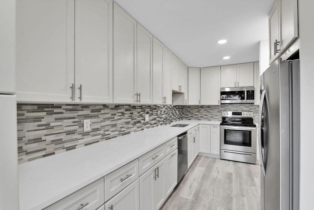 Photo of 8844 Belle Aire Dr #224, Boca Raton, FL 33433 (MLS # R11124306)