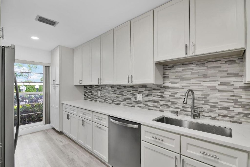 Photo of 8844 Belle Aire Dr #224, Boca Raton, FL 33433 (MLS # R11124306)