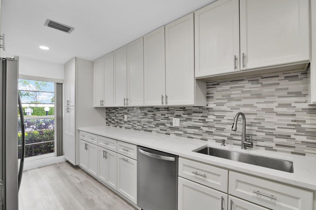 Photo of 8844 Belle Aire Dr #224, Boca Raton, FL 33433 (MLS # R11124306)