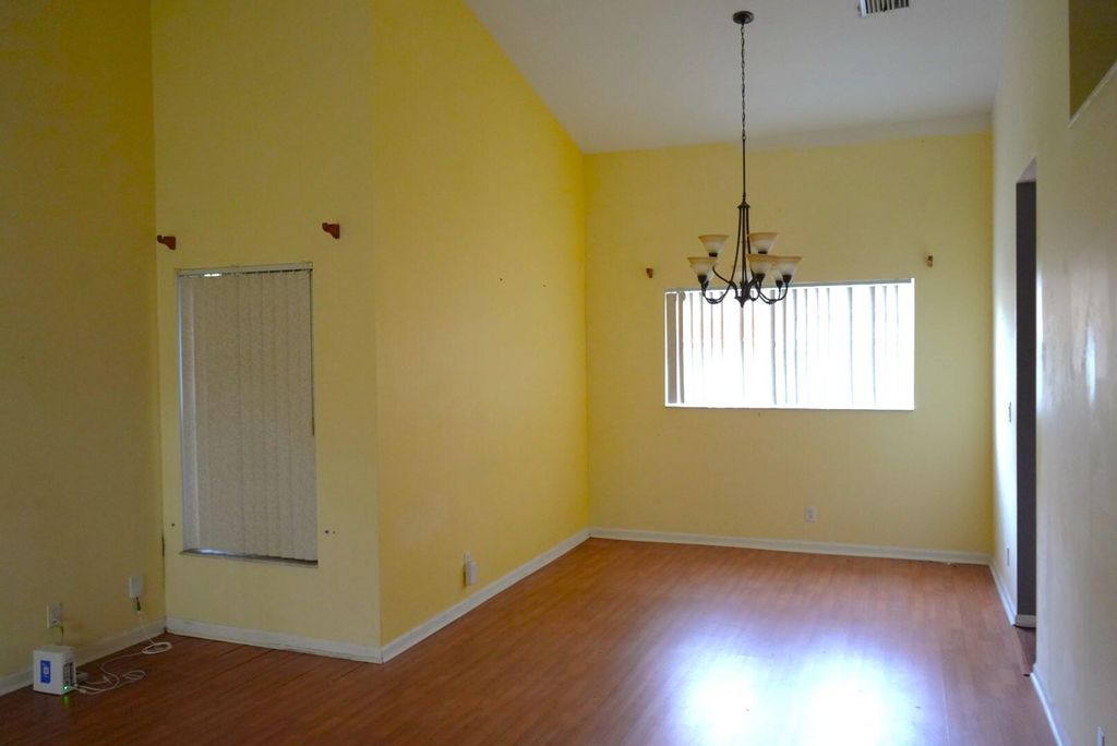 Photo of 133 Heatherwood Drive, Royal Palm Beach, FL 33411 (MLS # R10953912)