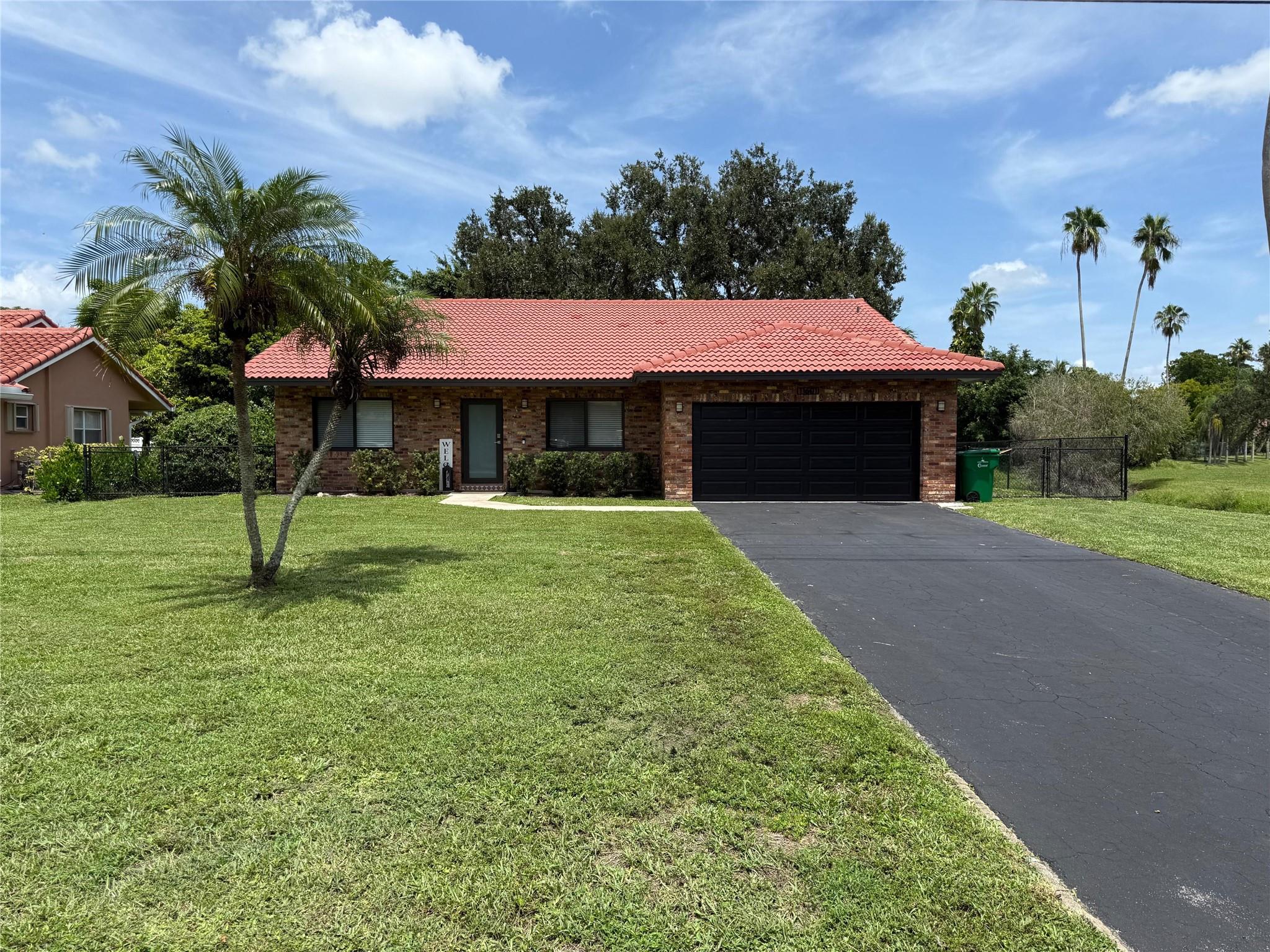 Welcome to your Coral Springs haven! Nestled on nearly ? acre, this fully renovated 3-bed, 2-bath ranch (approx. 1,745 sq ft + garage) delivers prime West Coral Springs living—no HOA. Built in 1986, it shines with hurricane-impact windows, doors, and garage door, new tile flooring, and updated kitchen and baths. The split-bedroom plan features a walk-in closet, pantry, bonus room/office, and cabana bath. Outside, enjoy a fenced yard backing to a tranquil canal, with room for a pool plus space for boat or RV. A 2-car garage, utility/laundry, and built-ins add comfort in a standout location near golf, parks, shopping, and highways.