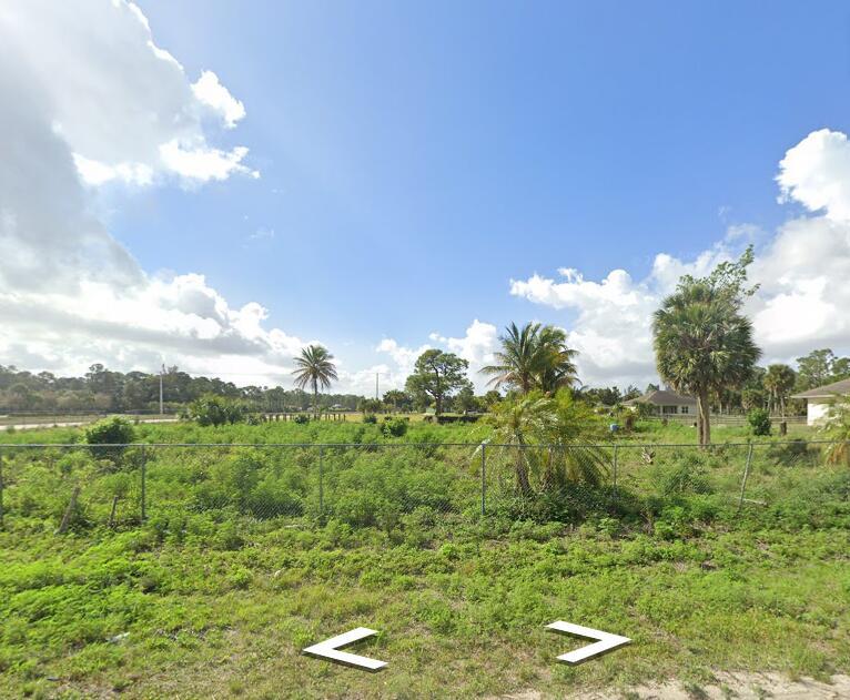 Prime corner lot in The Acreage! Peaceful rural vibe just 5 mins to Publix, 10 mins to Westlake amenities. Easy access via paved roads. Ideal for custom home or investment. No HOA. Buyer responsible for all due diligence.