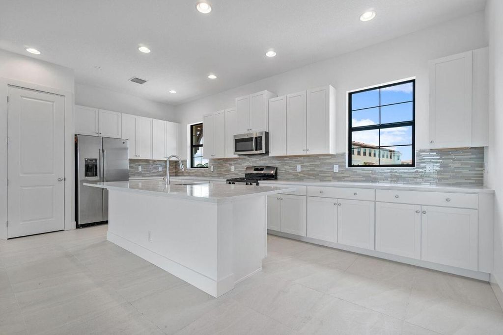 Photo of 5105 Beckman Terrace, Palm Beach Gardens, FL 33418 (MLS # R10947409)