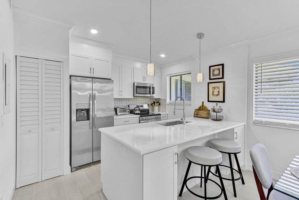 Photo of 106 Club Drive, Palm Beach Gardens, FL 33418 (MLS # B26038994)