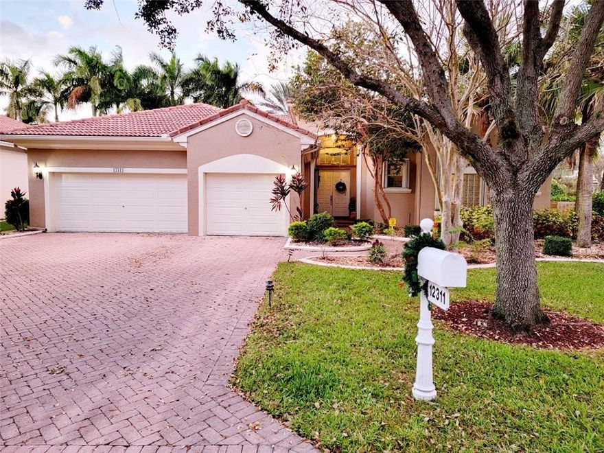 Excellent opportunity to live in desirable community of Venetian Isle located in Coral Springs. This beautiful tropical  corner lot home features crown molding throughout, tile floors, master suite with a sitting area, master bath has a roman tub, bidet and separate shower area. Kitchen has a new fridge, double ovens, center island, breakfast area and granite countertops. Heated pool and spa, accordion hurricane shutters and a Generac home generator, too many features to list. This is a must see. Submit your best offer. Buyer pays one time $790 capital contribution at closing.