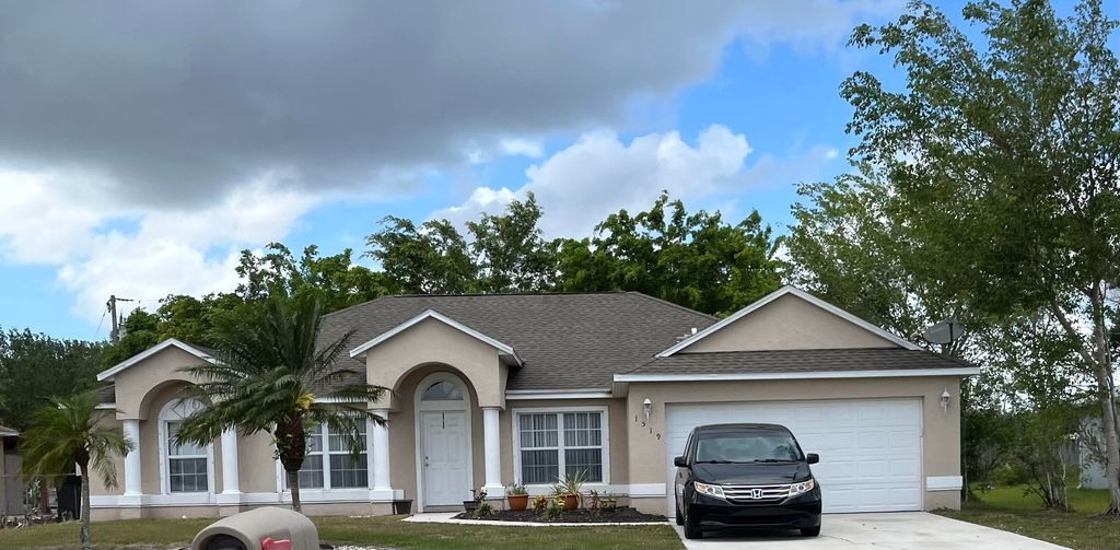 Photo of 1519 SW California Boulevard, Port Saint Lucie, FL 34986 (MLS # R10787628)