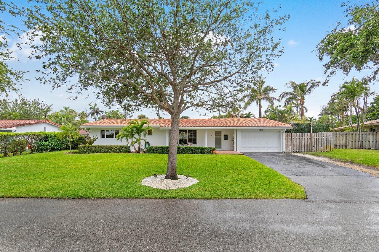Beautiful pool home on a lovely, quiet street in Lighthouse Point! Backyard oasis with a shady louvered pergola over a huge BBQ/bar area that is perfect for enjoying the big game! Impact windows and doors. Light, bright kitchen with a separate butler's pantry, perfect for culinary endeavors. This home is ideal for entertaining, featuring spacious living areas including a sunny Florida room and a generous family room. The third bedroom can easily transform into a den or office space. Lg shed perfect for man cave or workshop. Additional Features include, crown molding, ceramic tile floors, RV/boat area with electric on the side of the house. DeGroff intracoastal park is a short walk away. Dan Witt Park is a short bike ride with pickleball, baseball, basketball and more.