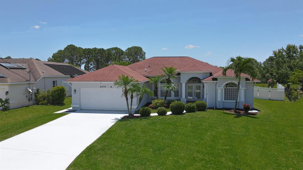 Photo of 6170 NW Hacienda Lane, Port St Lucie, FL 34986 (MLS # R10888865)