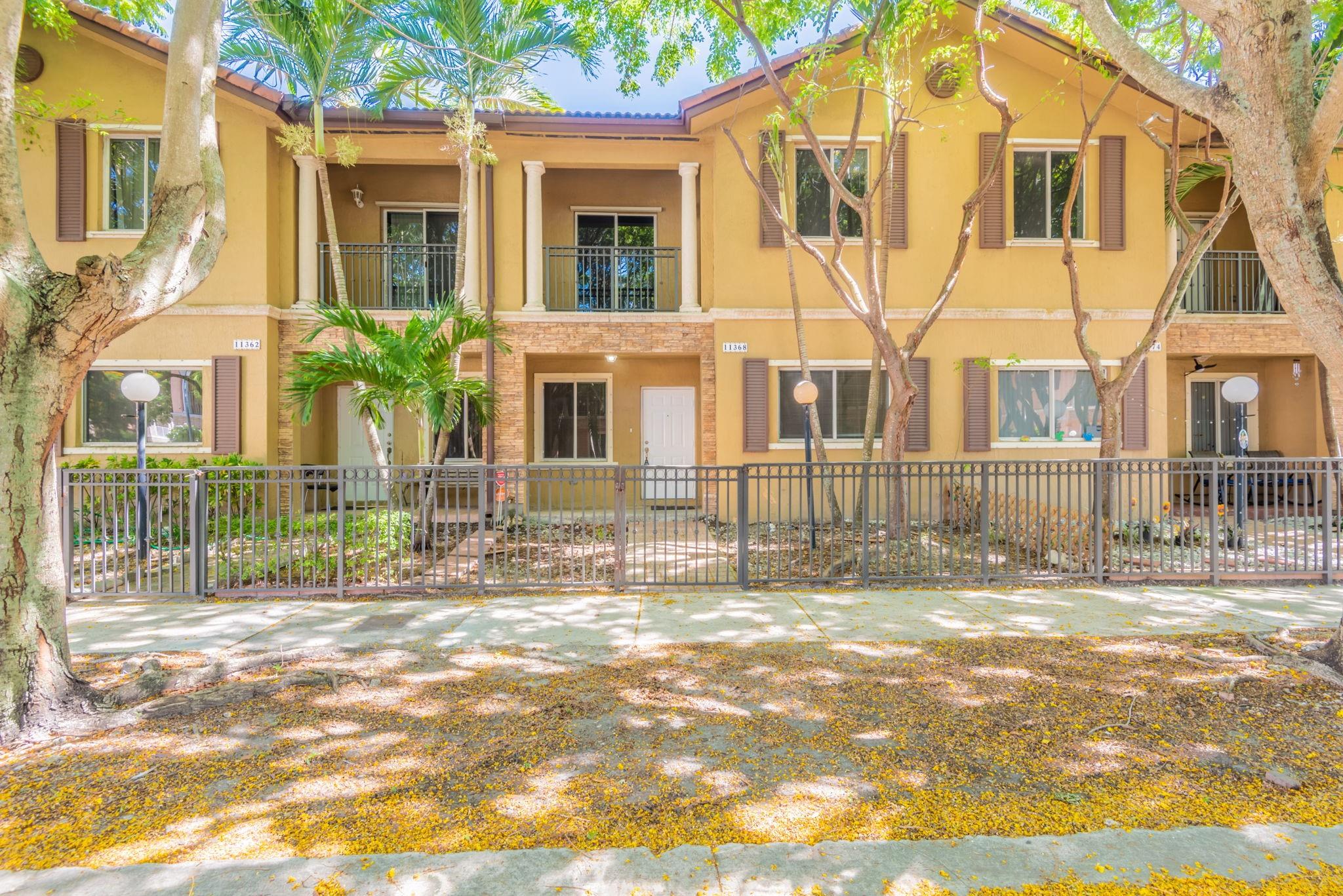 Spacious 2-story townhouse featuring 4 bedrooms and 2.5 bathrooms with an attached 1-car garage. Enjoy indoor-outdoor living with a front balcony, back balcony, and a cozy front porch. The open floor plan includes a kitchen bar perfect for casual dining and entertaining. A dedicated laundry room adds convenience, and the fenced-in front yard offers privacy and outdoor space. Schedule a showing today! One or more photos have been virtually staged.
